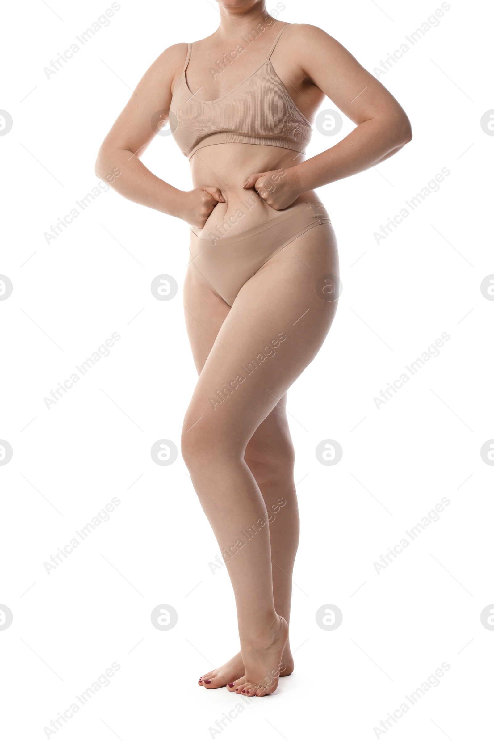 Photo of Liposuction. Woman in underwear touching her belly on white background, closeup