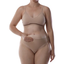 Photo of Liposuction. Woman in underwear touching her belly on white background, closeup
