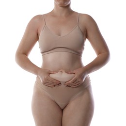 Photo of Liposuction. Woman in underwear touching her belly on white background, closeup