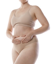 Photo of Liposuction. Woman in underwear touching her belly on white background, closeup