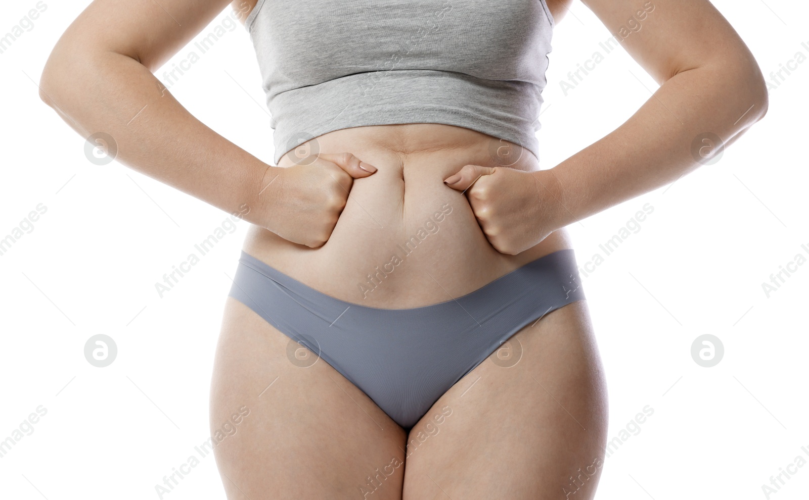 Photo of Liposuction. Woman in underwear touching her belly on white background, closeup