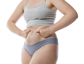 Photo of Liposuction. Woman in underwear touching her belly on white background, closeup
