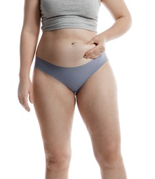 Photo of Liposuction. Woman in underwear touching her belly on white background, closeup