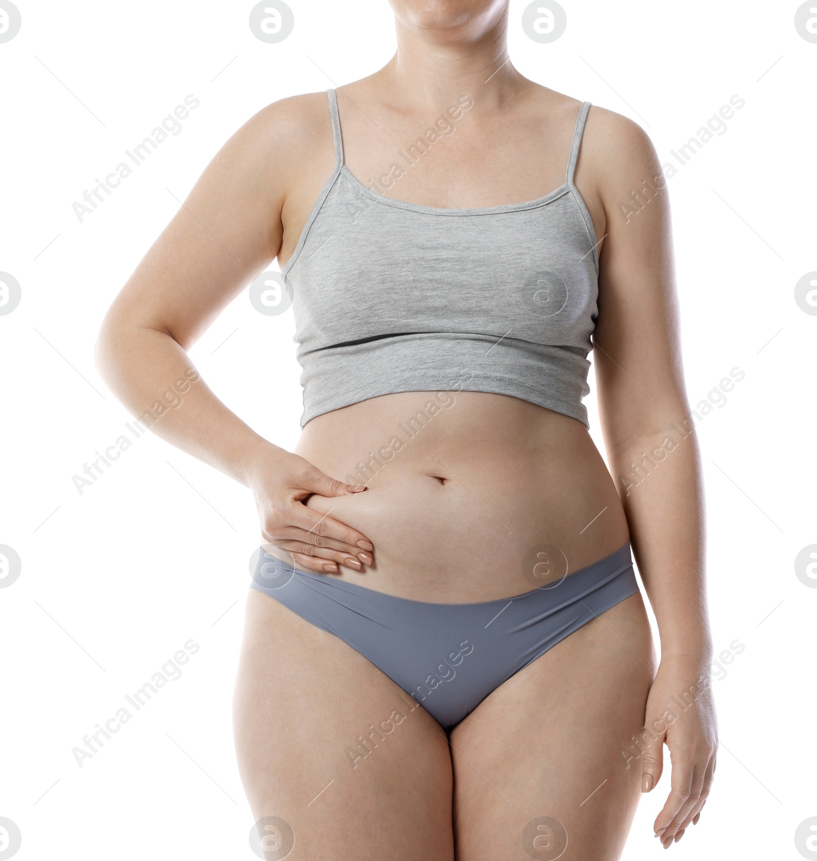 Photo of Liposuction. Woman in underwear touching her belly on white background, closeup