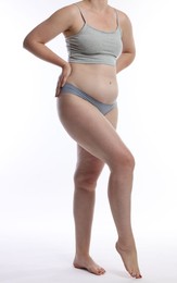 Photo of Liposuction. Woman in underwear on white background, closeup