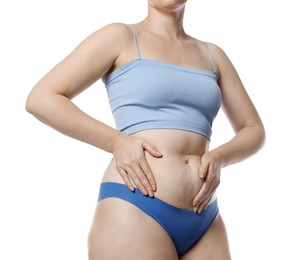 Photo of Liposuction. Woman in underwear touching her belly on white background, closeup
