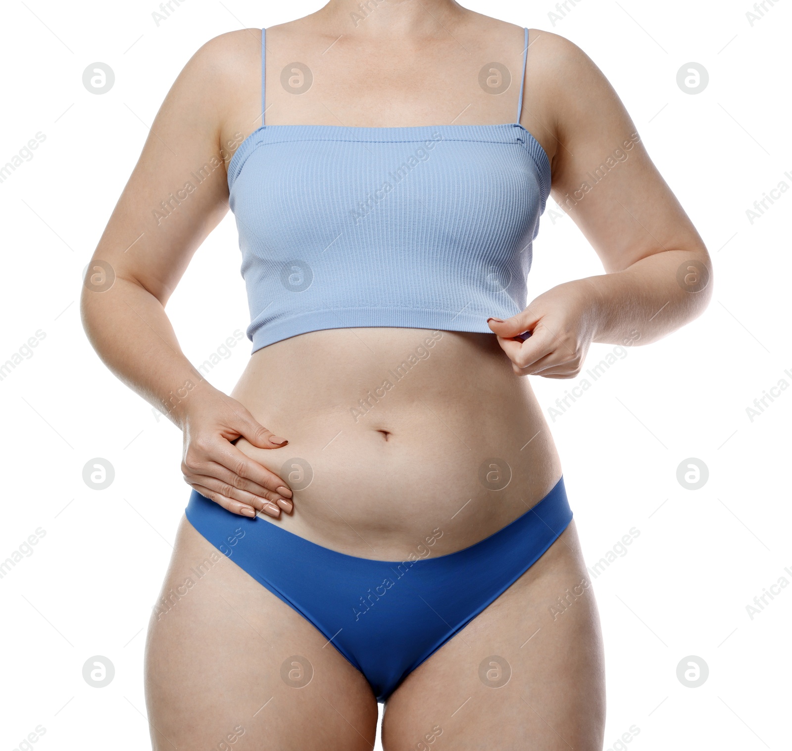 Photo of Liposuction. Woman in underwear touching her belly on white background, closeup