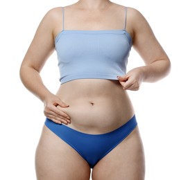 Photo of Liposuction. Woman in underwear touching her belly on white background, closeup