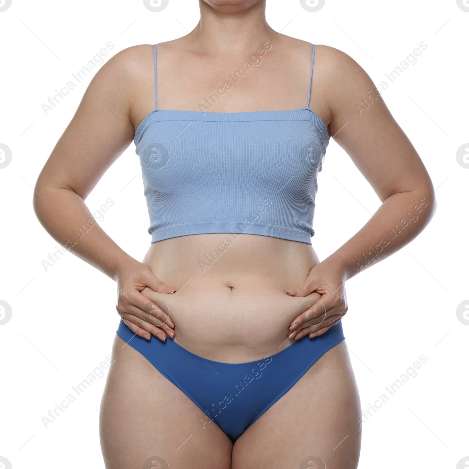 Photo of Liposuction. Woman in underwear touching her belly on white background, closeup