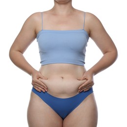Photo of Liposuction. Woman in underwear touching her belly on white background, closeup