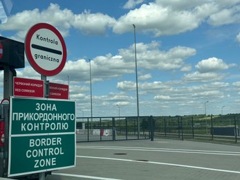 Photo of Malhowice-Nyzhankovychi, Ukraine, Poland - June 21, 2025: Border checkpoint with signs at Polish-Ukrainian crossing