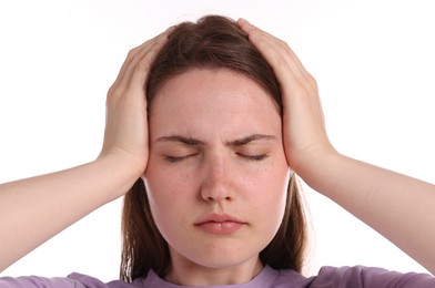 Photo of Young woman suffering from headache on white background