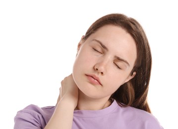 Photo of Young woman suffering from neck pain on white background