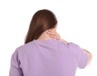 Photo of Young woman suffering from neck pain on white background, back view