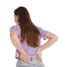 Photo of Young woman suffering from back pain on white background