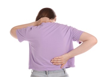 Photo of Young woman suffering from back pain on white background