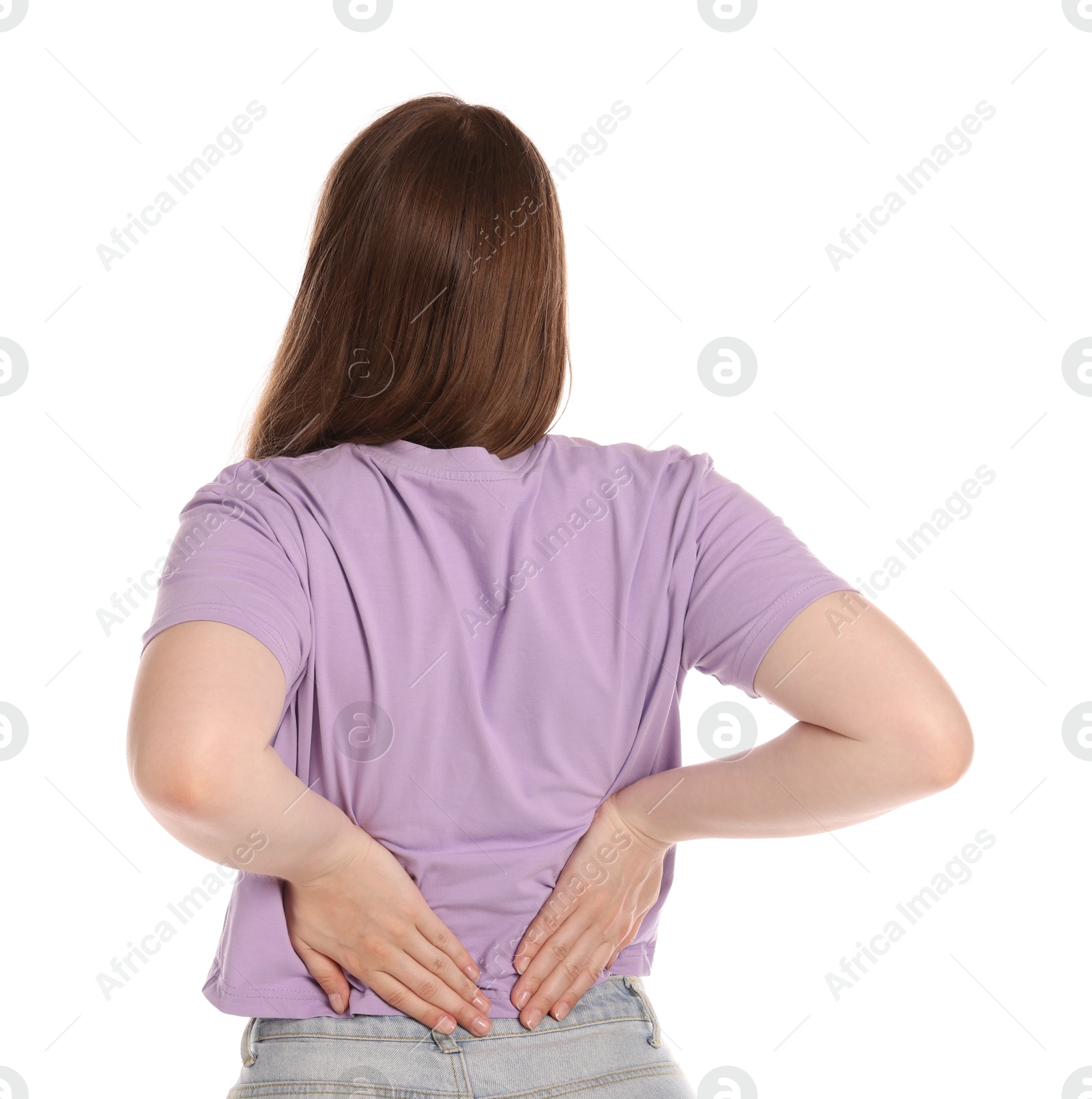 Young woman suffering from back pain on white background Photo of Young woman suffering from back pain on white background