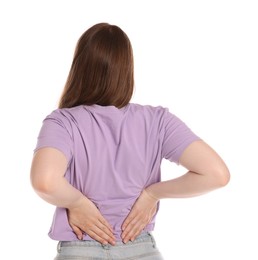 Photo of Young woman suffering from back pain on white background