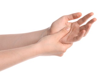Photo of Young woman suffering from wrist pain on white background, closeup