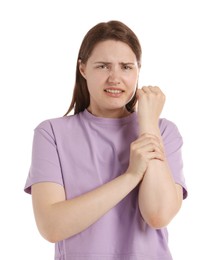 Photo of Young woman suffering from wrist pain on white background