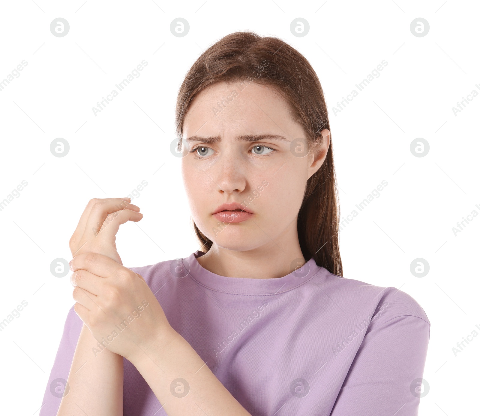 Young woman suffering from wrist pain on white background Photo of Young woman suffering from wrist pain on white background