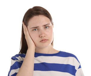 Photo of Young woman suffering from headache on white background