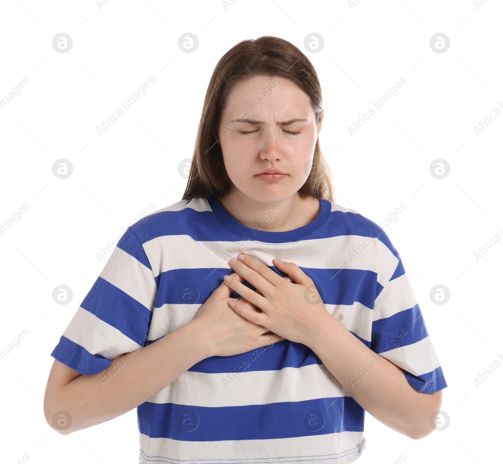 Young woman suffering from chest pain on white background Photo of Young woman suffering from chest pain on white background
