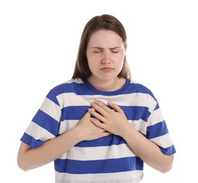 Photo of Young woman suffering from chest pain on white background