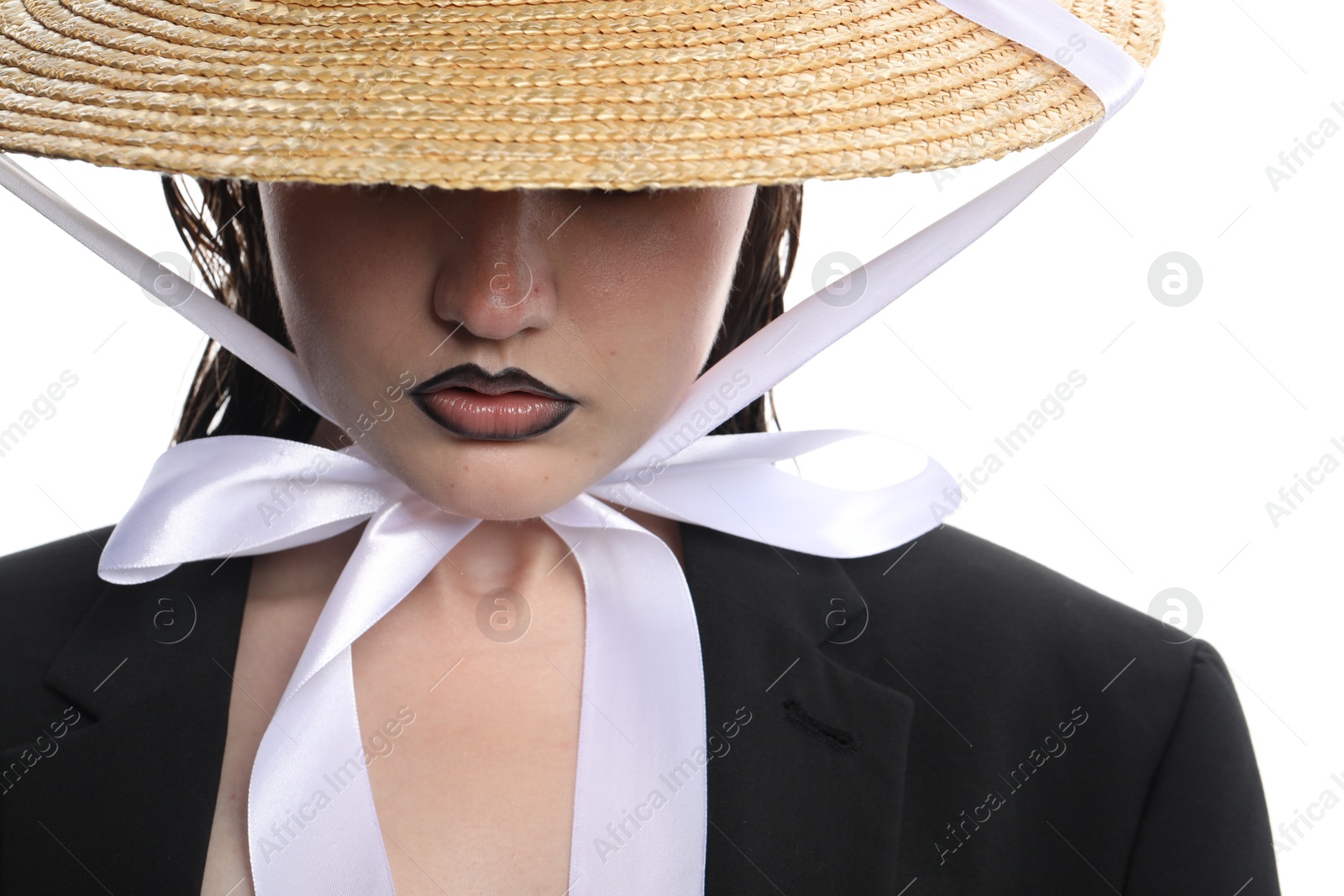 Beautiful young woman with black lip liner wearing straw hat on white background, closeup Photo of Beautiful young woman with black lip liner wearing straw hat on white background, closeup