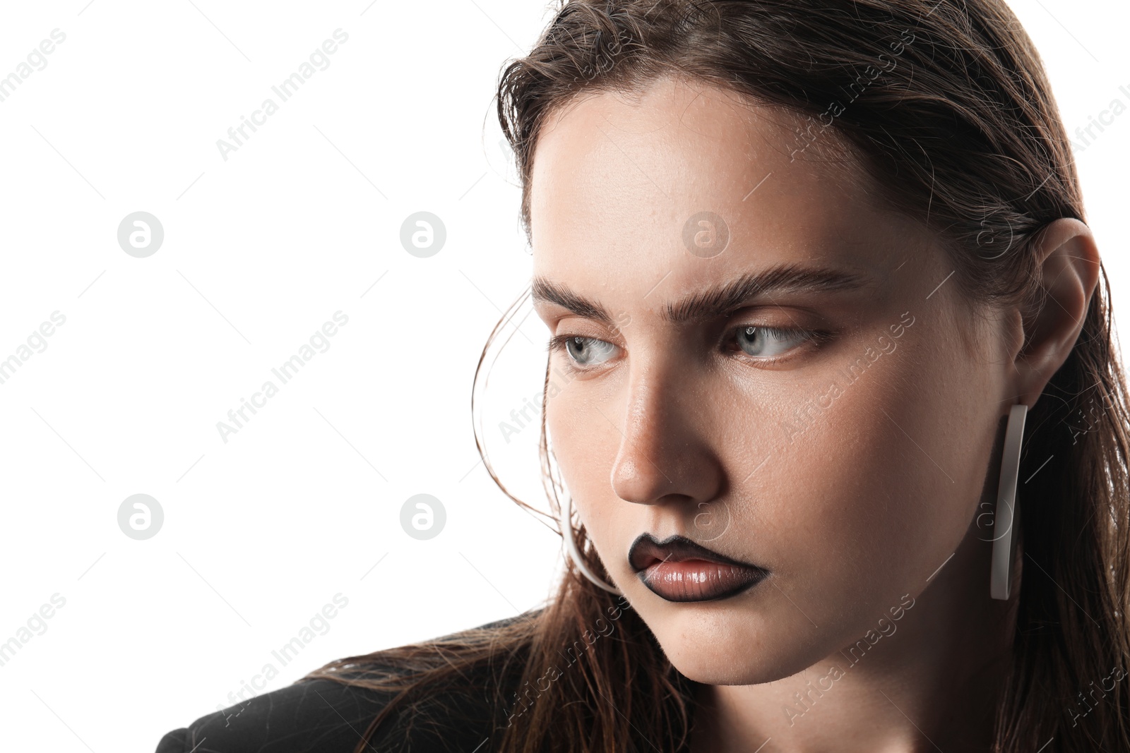 Beautiful young woman with black lip liner wearing stylish earrings on white background, closeup Photo of Beautiful young woman with black lip liner wearing stylish earrings on white background, closeup