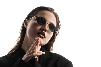 Photo of Beautiful young woman with black lip liner wearing wet sunglasses on white background