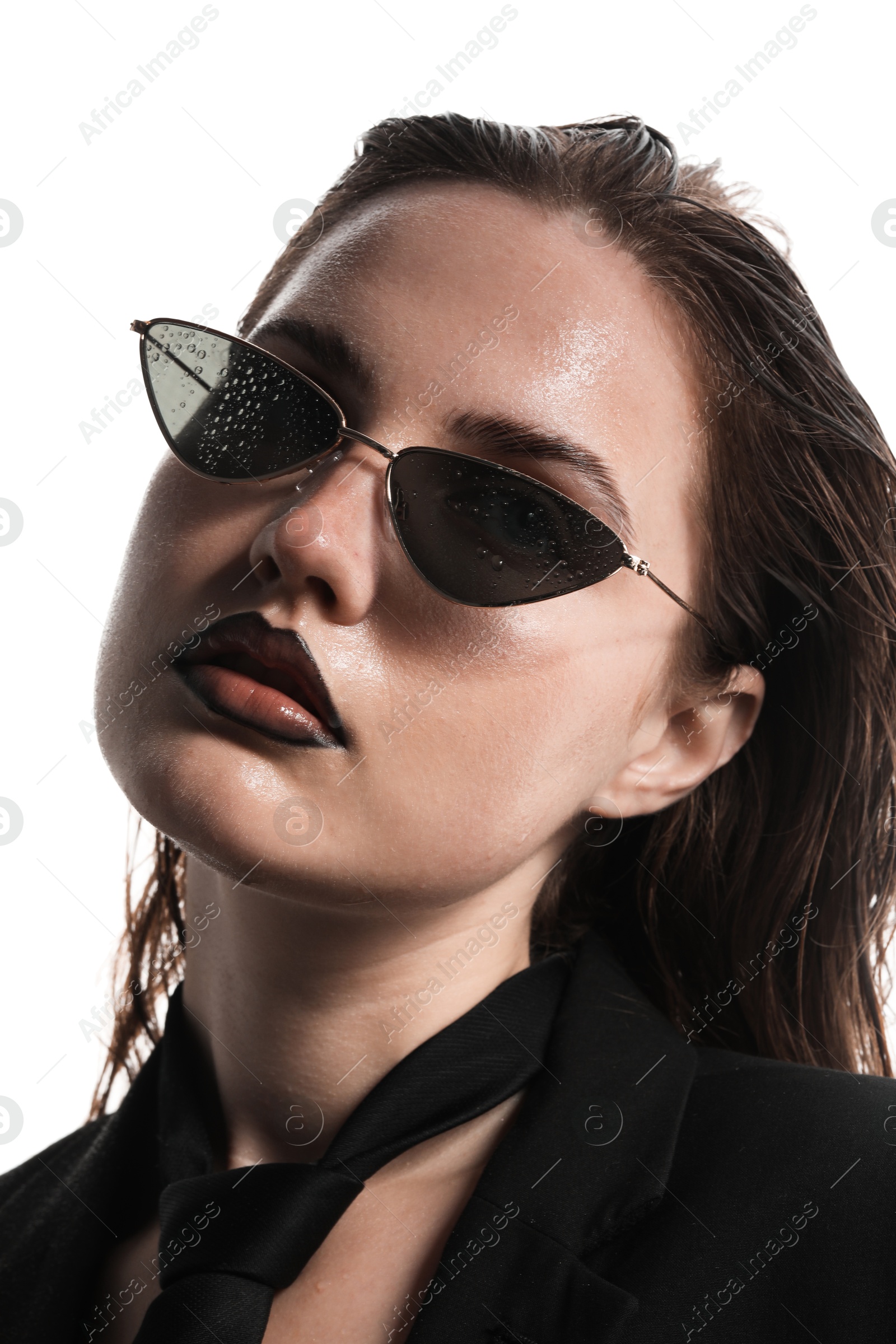 Beautiful young woman with black lip liner wearing wet sunglasses on white background, closeup Photo of Beautiful young woman with black lip liner wearing wet sunglasses on white background, closeup