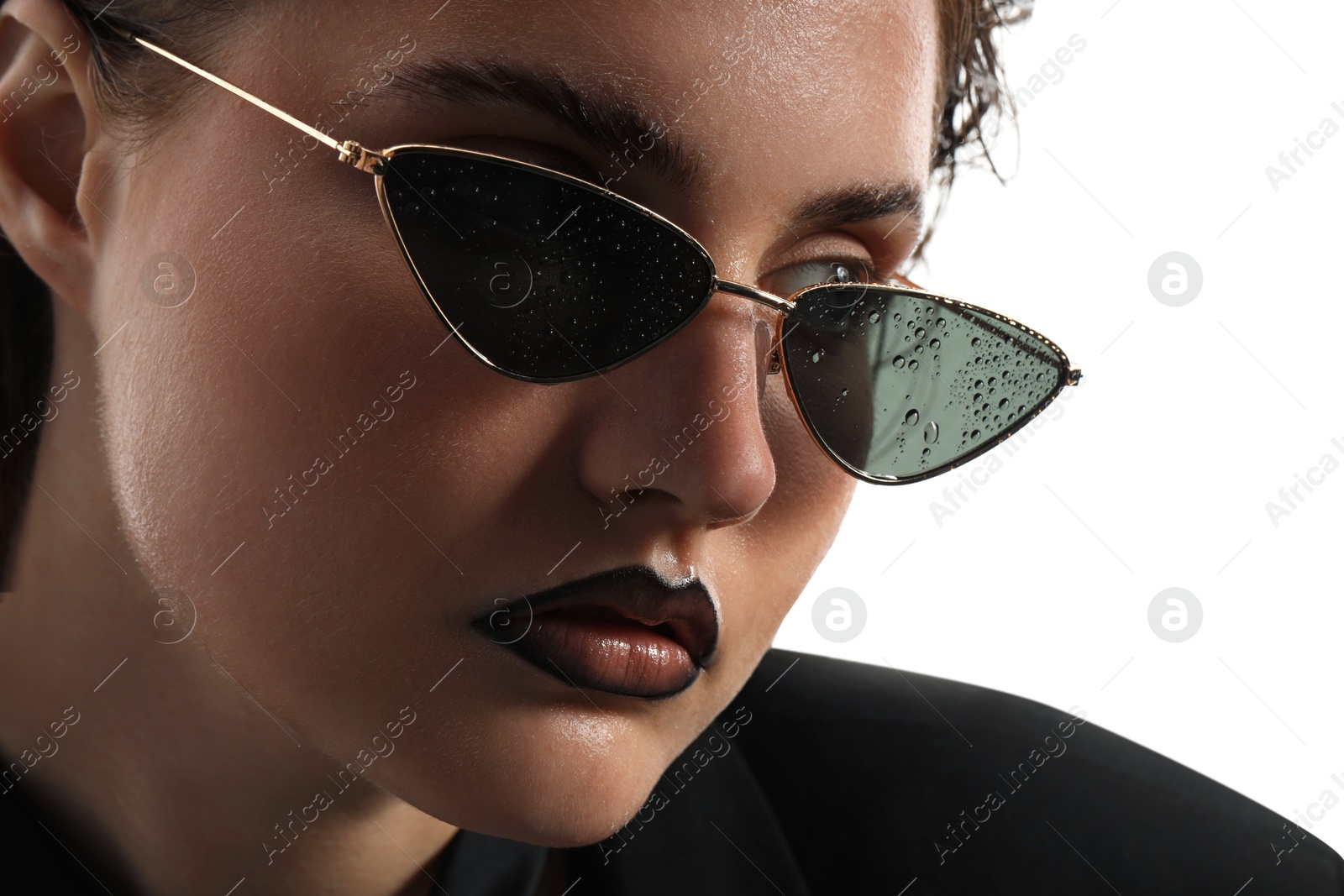Beautiful young woman with black lip liner wearing wet sunglasses on white background, closeup Photo of Beautiful young woman with black lip liner wearing wet sunglasses on white background, closeup
