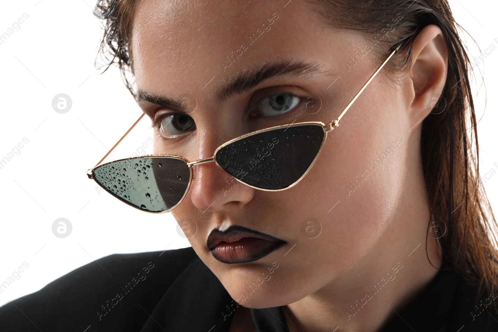 Beautiful young woman with black lip liner wearing wet sunglasses on white background, closeup Photo of Beautiful young woman with black lip liner wearing wet sunglasses on white background, closeup