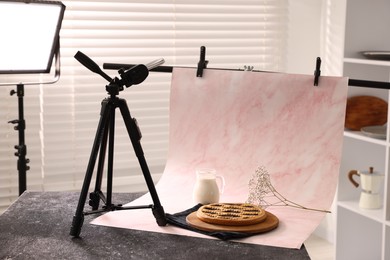 Photo of Shooting tasty pie and milk with smartphone in studio. Professional food photography