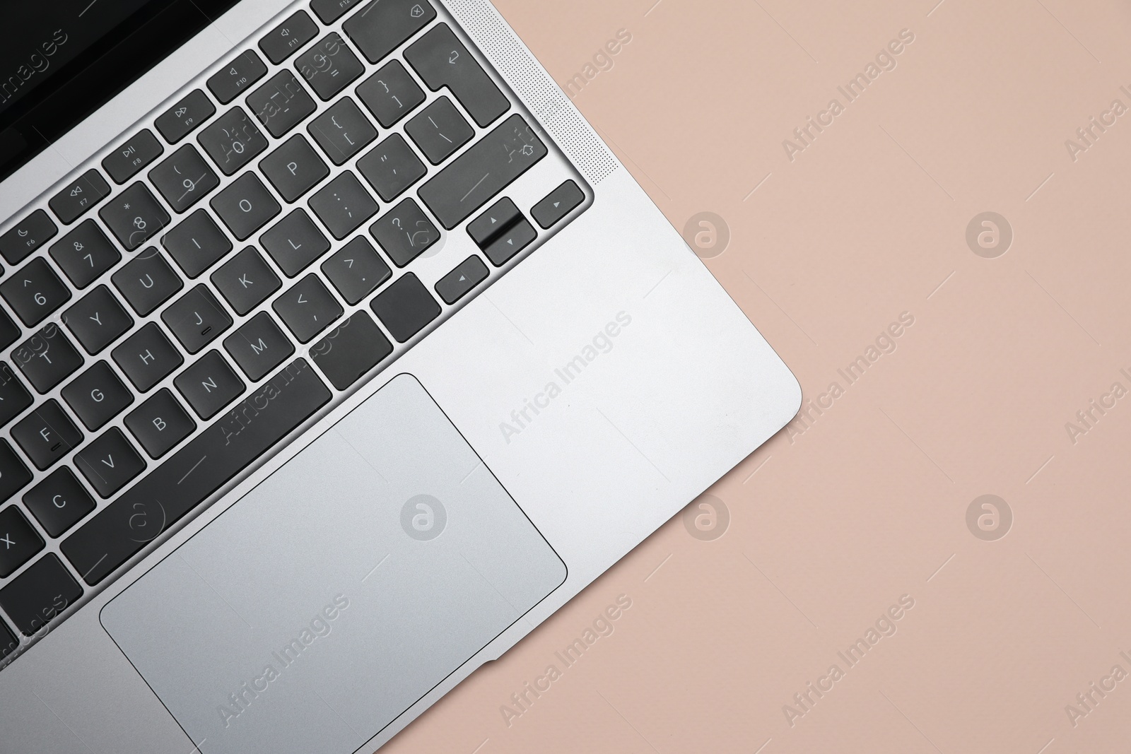 Modern laptop with keyboard on beige background, top view. Space for text Photo of Modern laptop with keyboard on beige background, top view. Space for text
