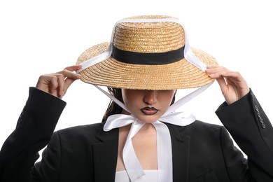 Photo of Beautiful young woman with black lip liner wearing straw hat on white background