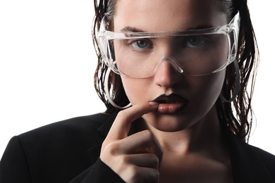 Photo of Beautiful young woman with black lip liner wearing glasses on white background, closeup