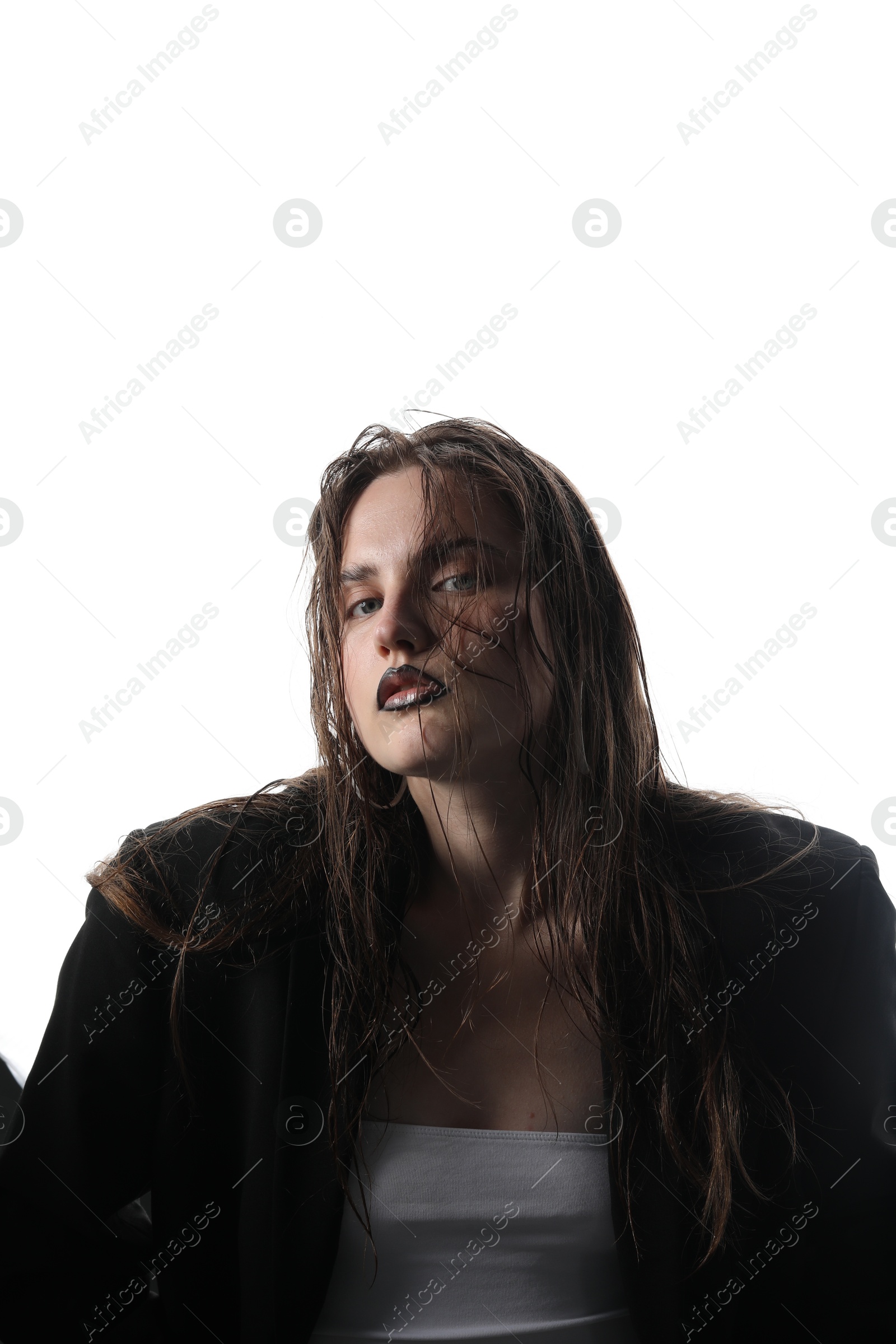 Beautiful young woman with black lip liner wearing stylish earrings on white background Photo of Beautiful young woman with black lip liner wearing stylish earrings on white background