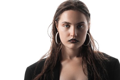 Photo of Beautiful young woman with black lip liner wearing stylish earrings on white background