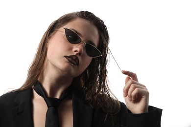 Photo of Beautiful young woman with black lip liner wearing wet sunglasses on white background