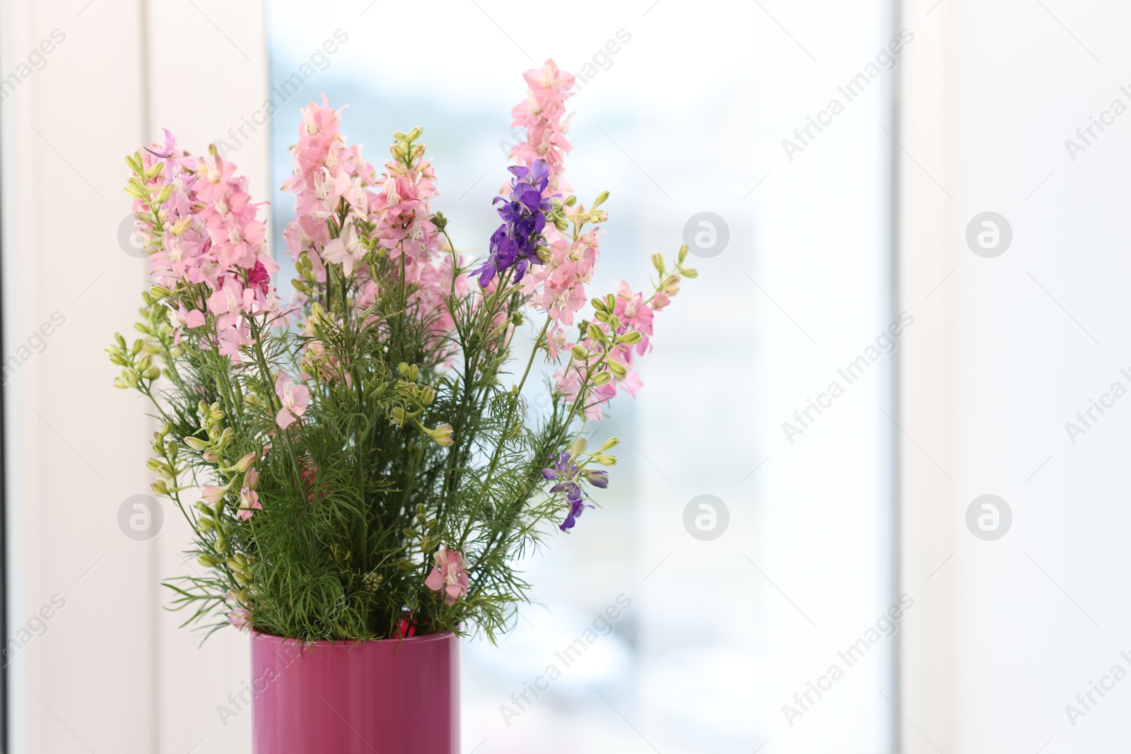 Bouquet of beautiful flowers on windowsill indoors, closeup. Space for text Photo of Bouquet of beautiful flowers on windowsill indoors, closeup. Space for text
