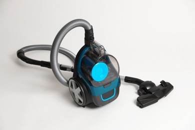 Photo of One vacuum cleaner on light grey background