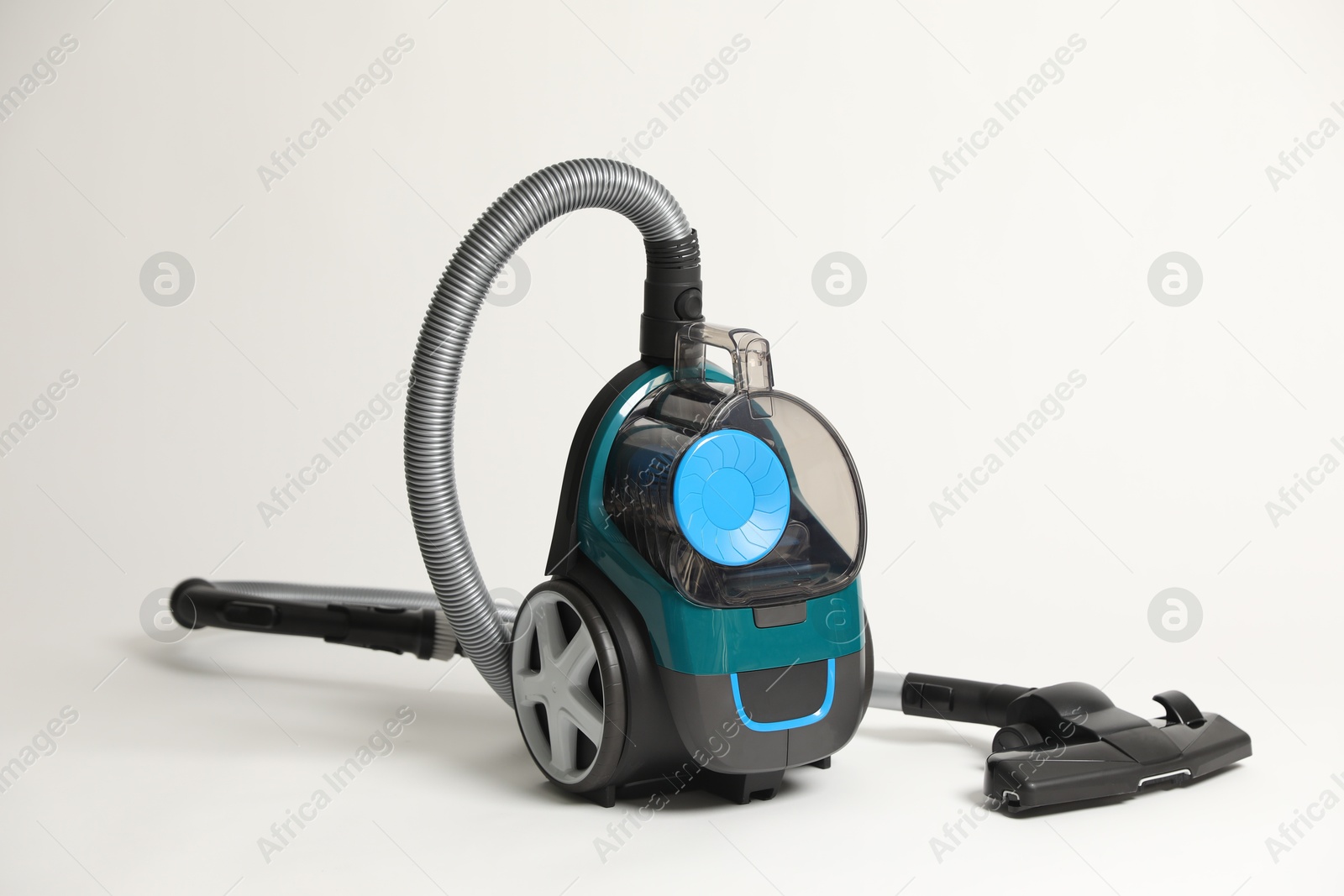 One vacuum cleaner on light grey background Photo of One vacuum cleaner on light grey background