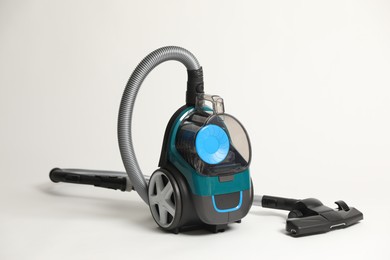 Photo of One vacuum cleaner on light grey background