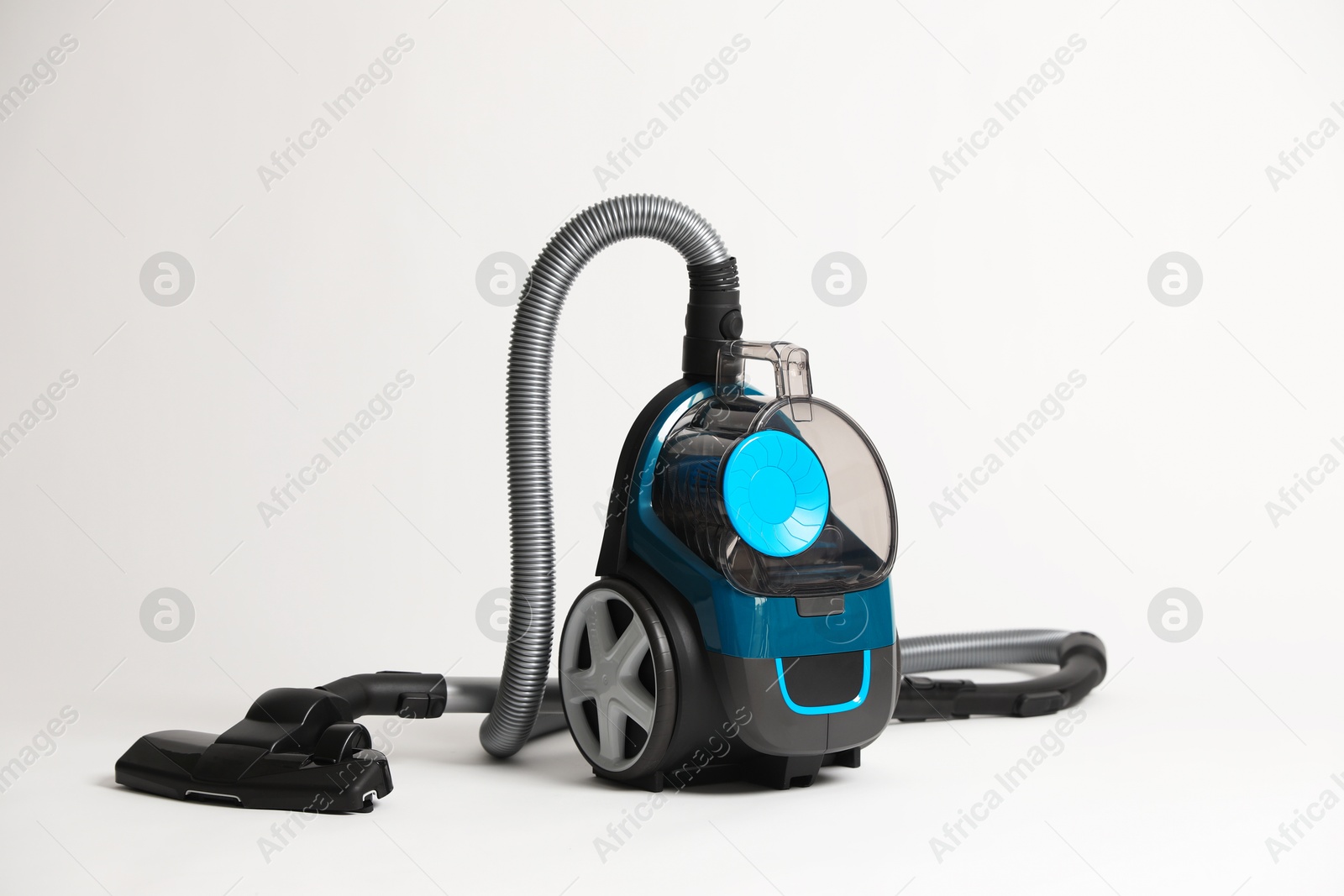 One vacuum cleaner on light grey background Photo of One vacuum cleaner on light grey background