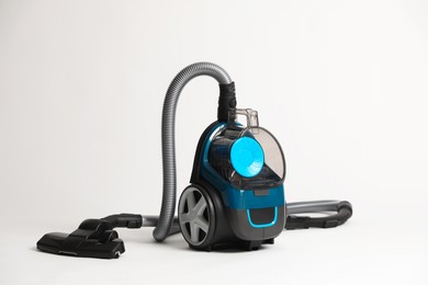 Photo of One vacuum cleaner on light grey background