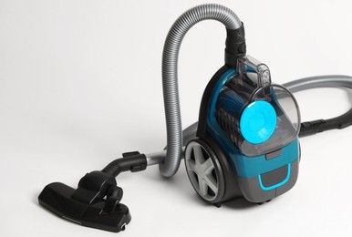 Photo of One vacuum cleaner on light grey background