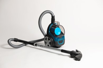 Photo of One vacuum cleaner on light grey background