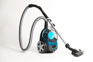 Photo of One vacuum cleaner on light grey background